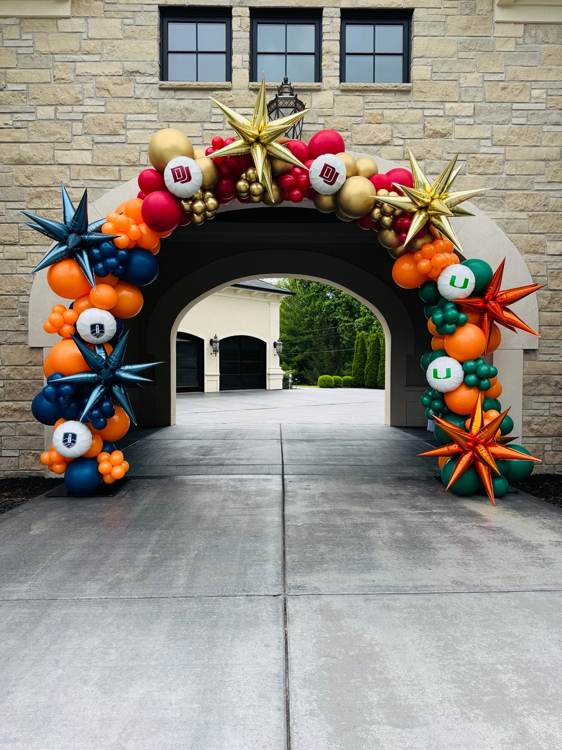 Graduation balloon arch with school colors and logos
