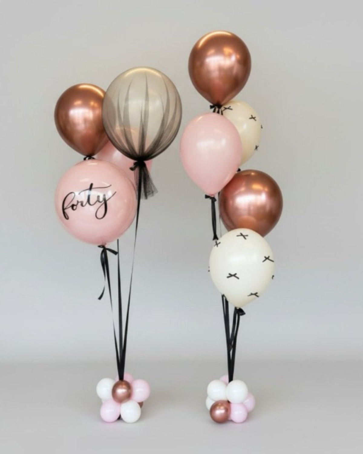 Party Hop specialty helium balloon bouquets in blush, cream and rose gold