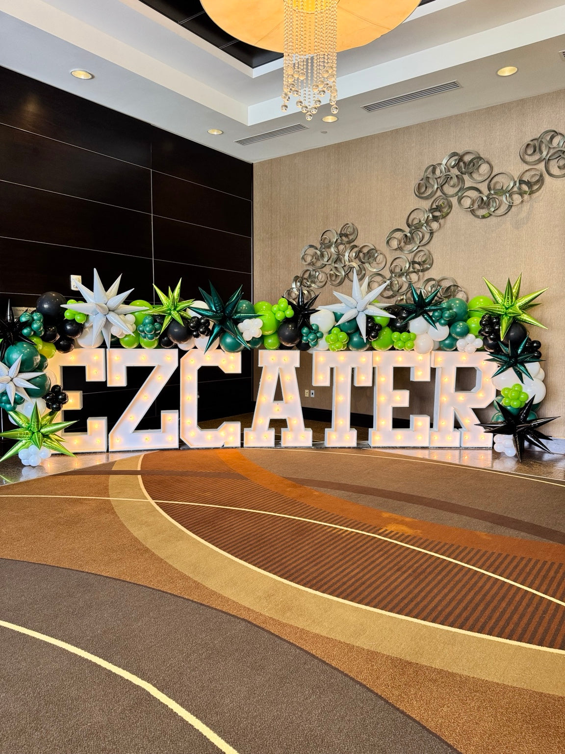 Party Hop branded corporate balloon display with marquee letters